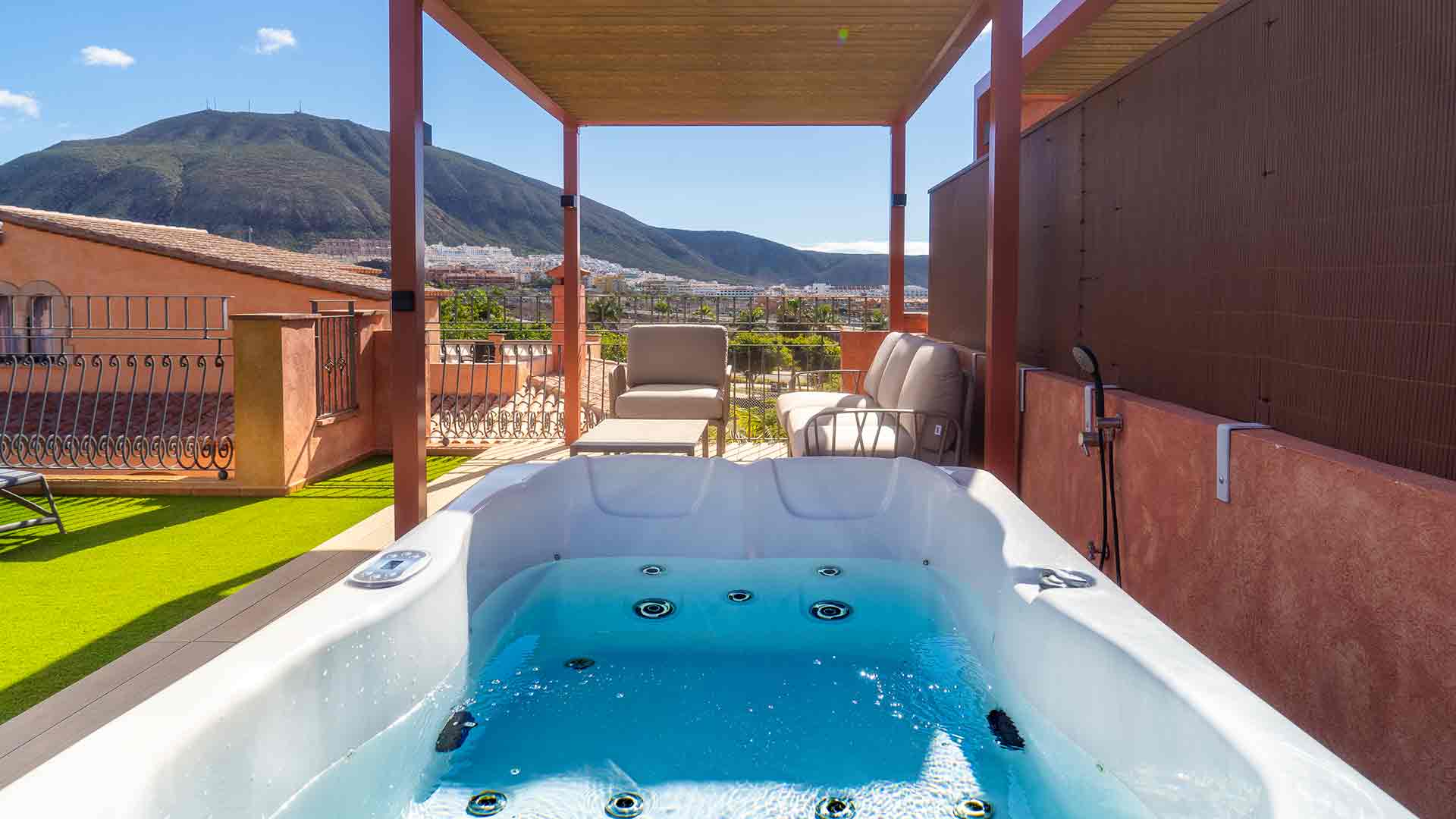 Relax in the outdoor jacuzzi with views